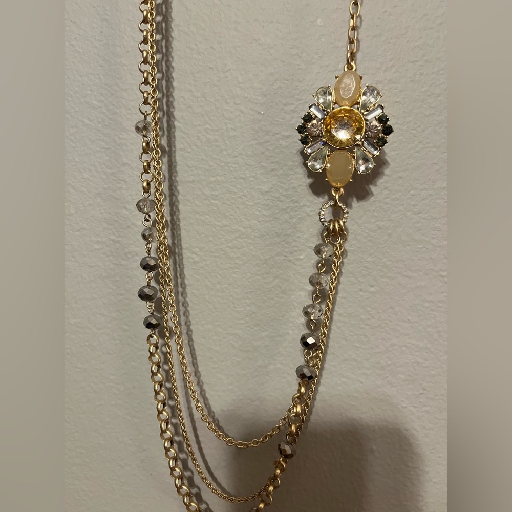 Long gold layered necklace with flower broach
